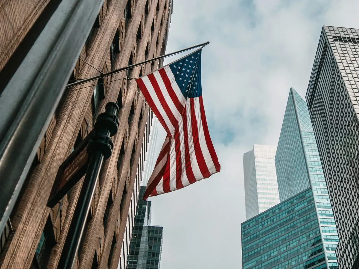 USCIS office building with the American flag, where the US citizenship interview is conducted.