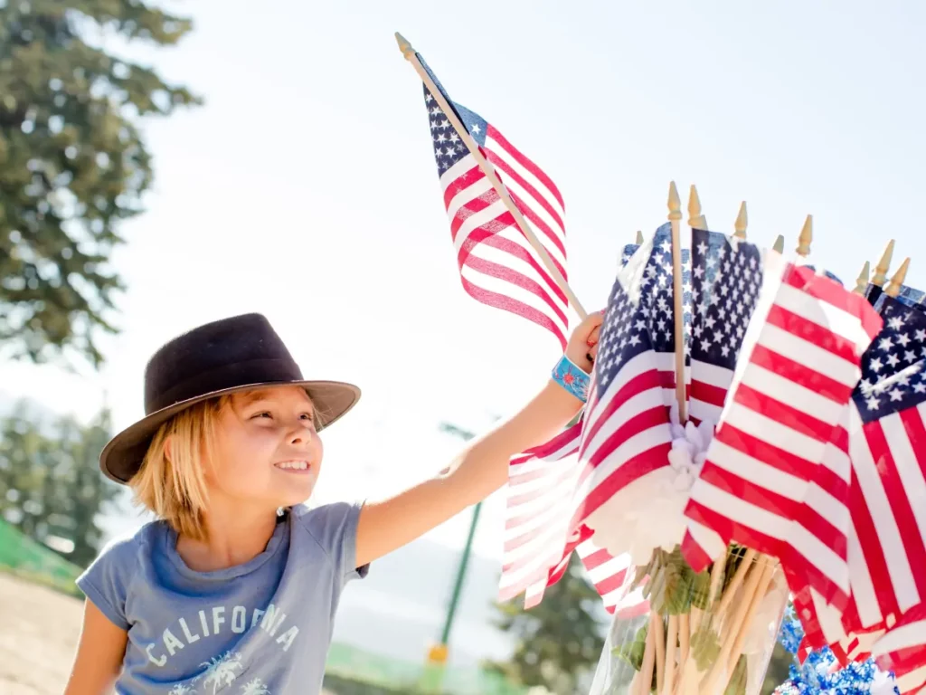 Boy waiving american flag