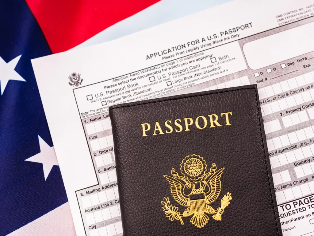 A US passport placed on top of an application form, illustrating the process to apply for a US passport successfully