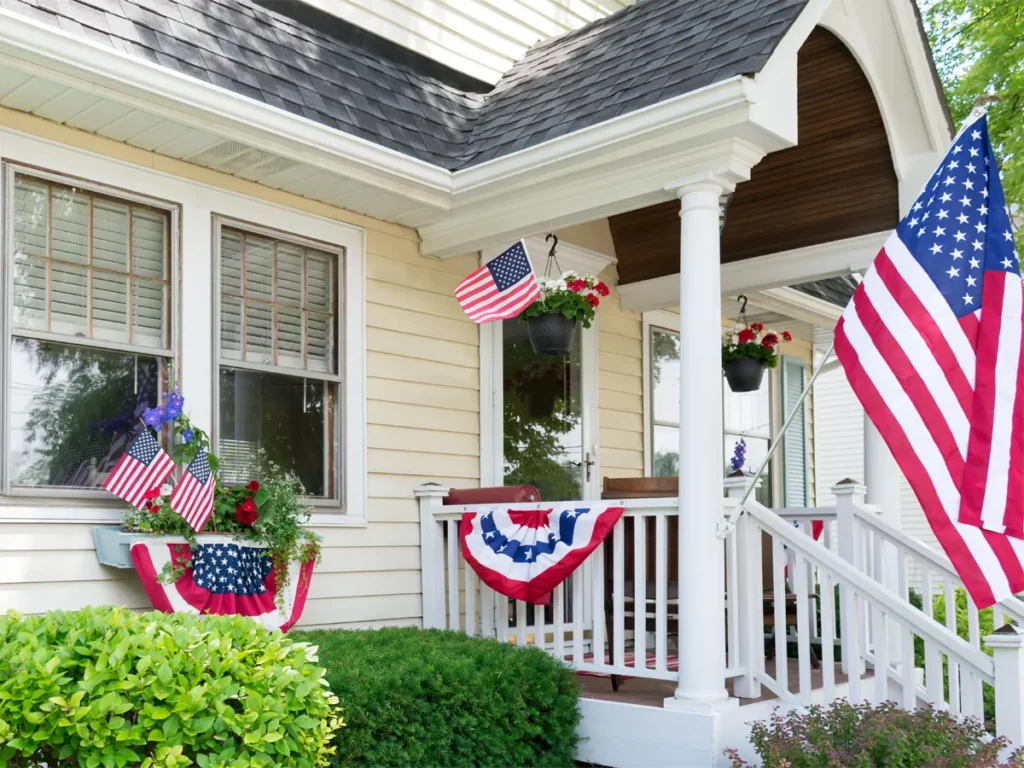 American house covered with flags showing patriotism - This is one interesting facts about United States