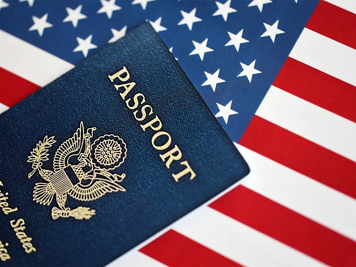 US passport with American flag highlighting passport vs card comparison