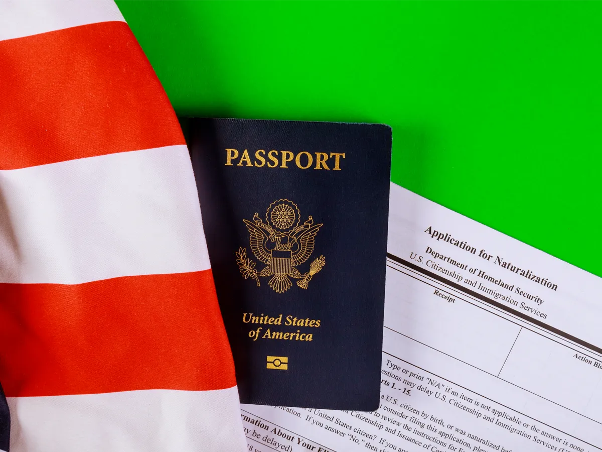Form N-400 and passport representing changing name during naturalization process