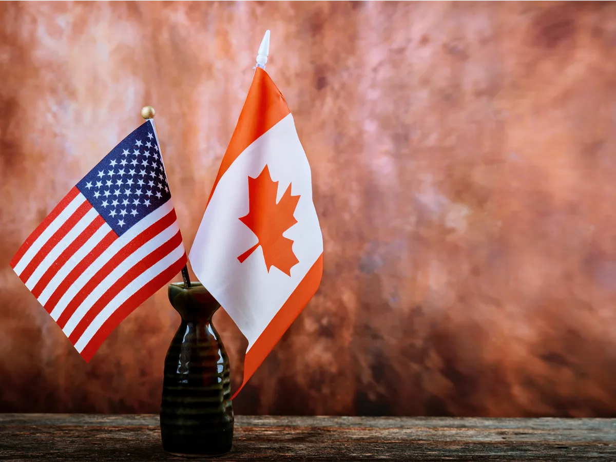 Can US citizens work in Canada with a work permit, USA and Canada flags