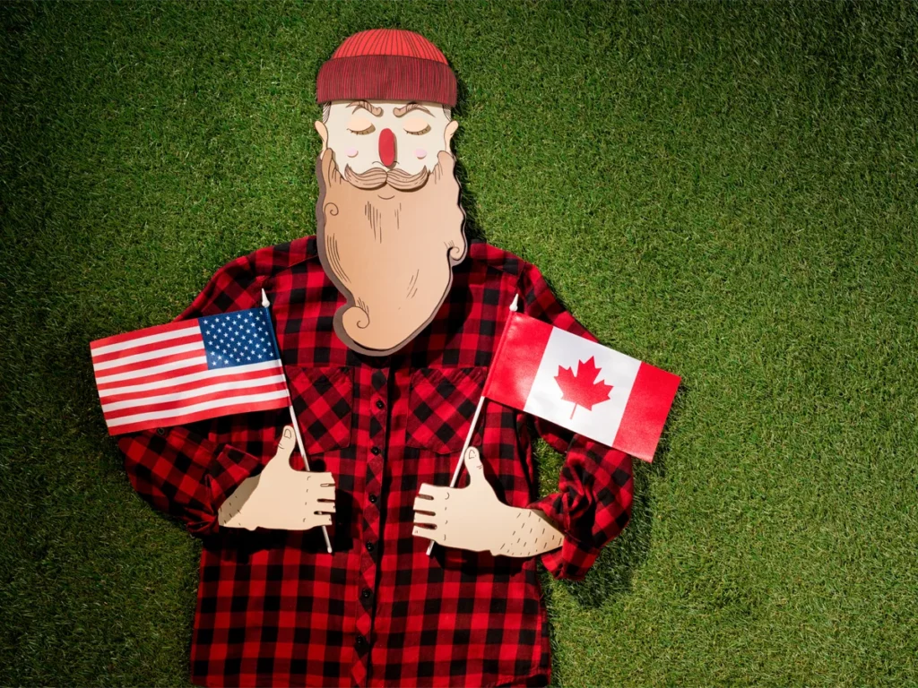 Can US citizens work in Canada, Canadian man holding USA and Canada flags