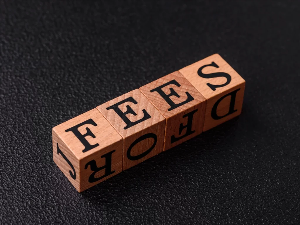 Fee waiver concept represented by wooden blocks spelling the word “fee”