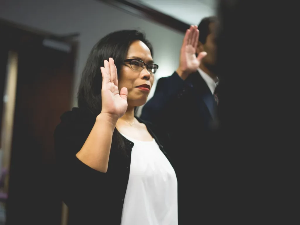 Applicant taking the Oath at a citizenship ceremony in Canada